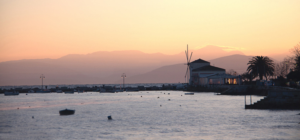 Windmill and Nautilus Cafe in Garitsa Bay